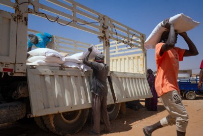 A women collects WFP food assistance in northern Sudan, even as humanitarian deliveries to the capital remain challenging.